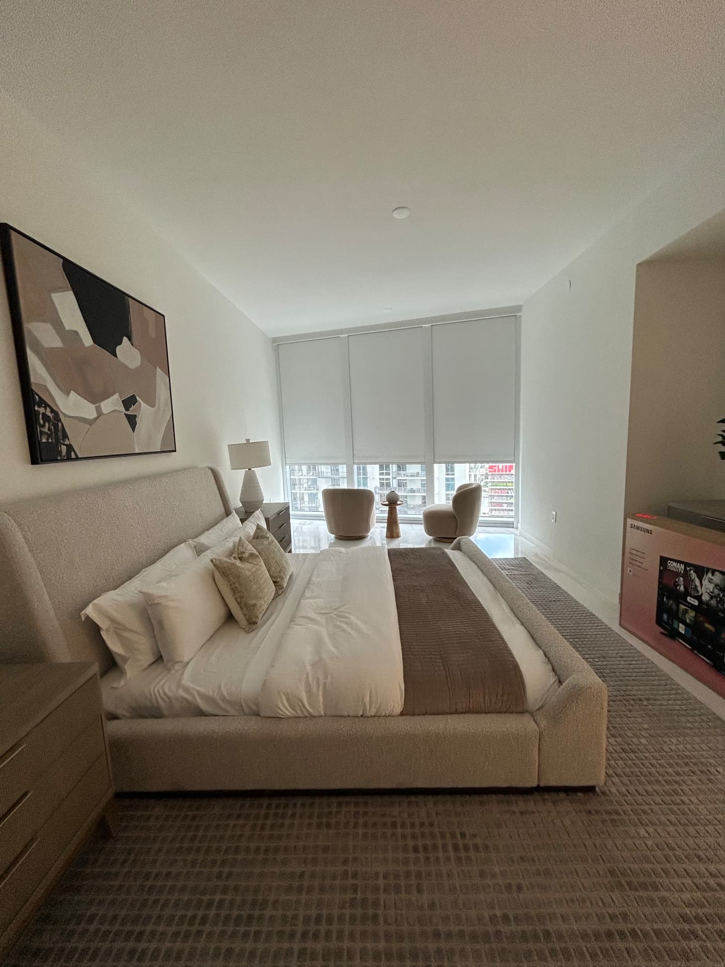Aston Martin Residences primary bedroom with three motorized roller shades