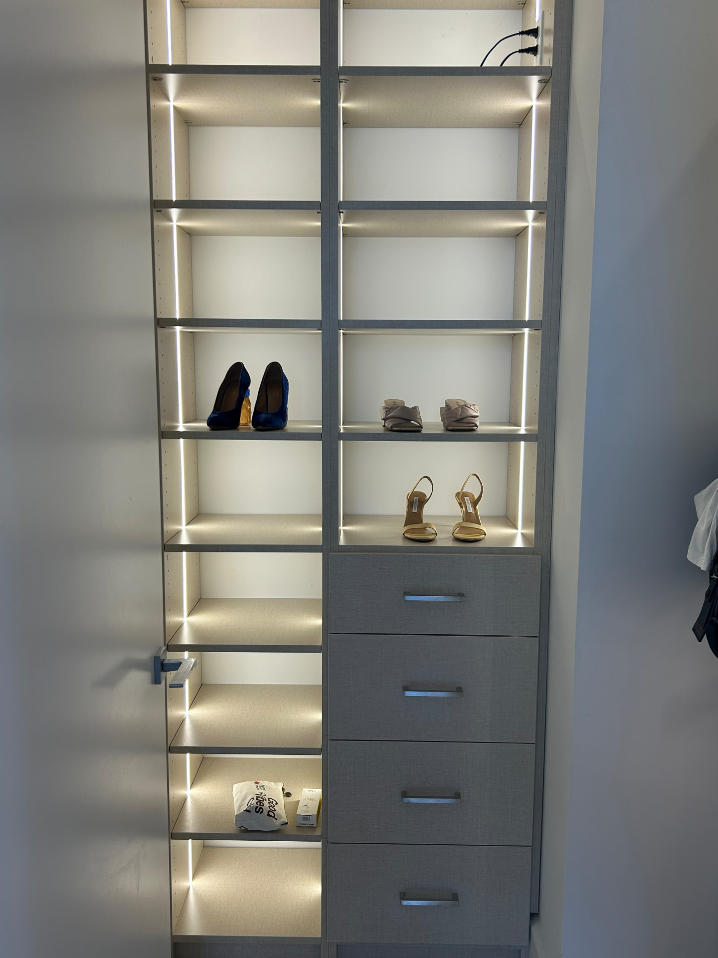 Missoni Baia closet detail with lit shoe shelving and drawers