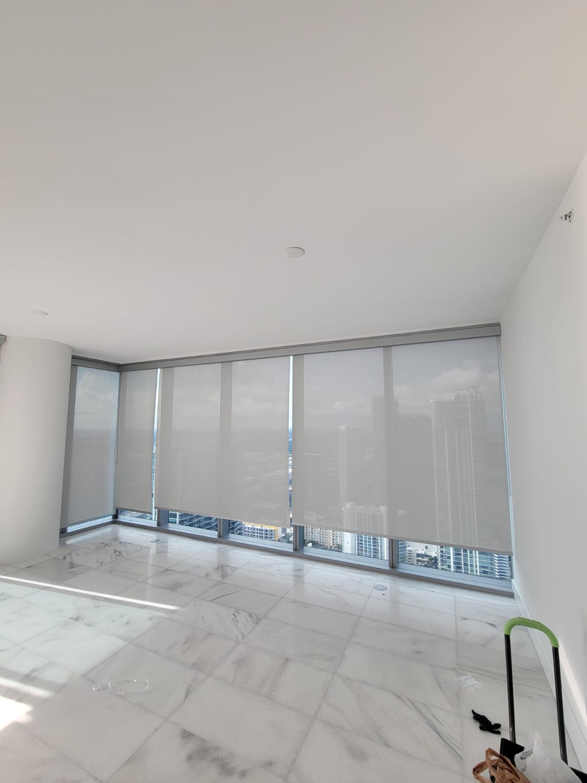 Missoni Baia corner living room with motorized roller shades