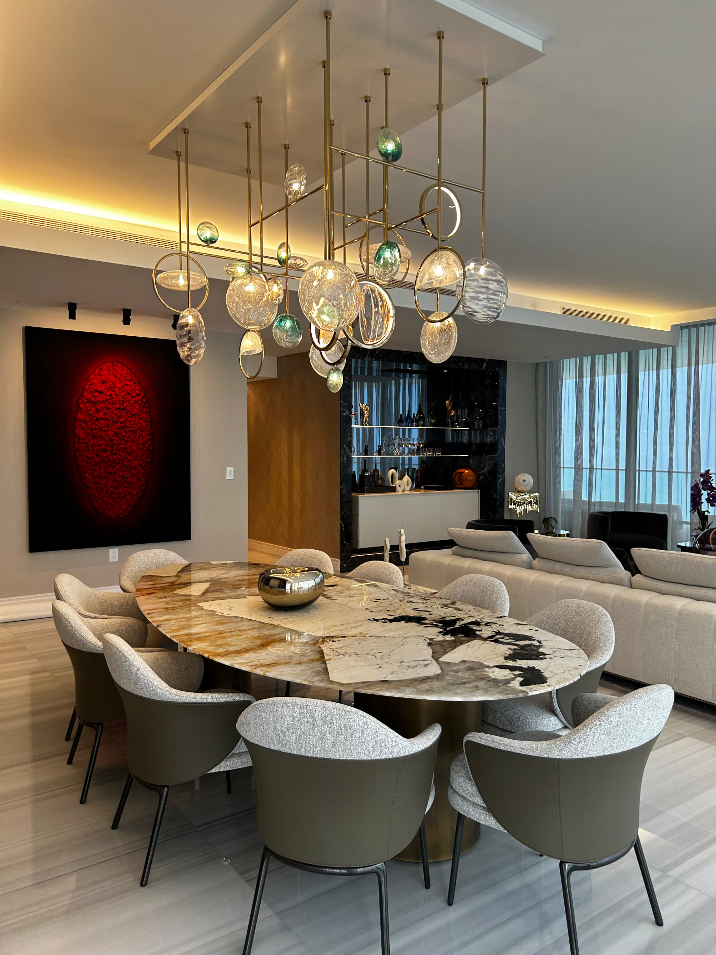 Estate at Acqualina dining room with sheer drapery along the glazed wall