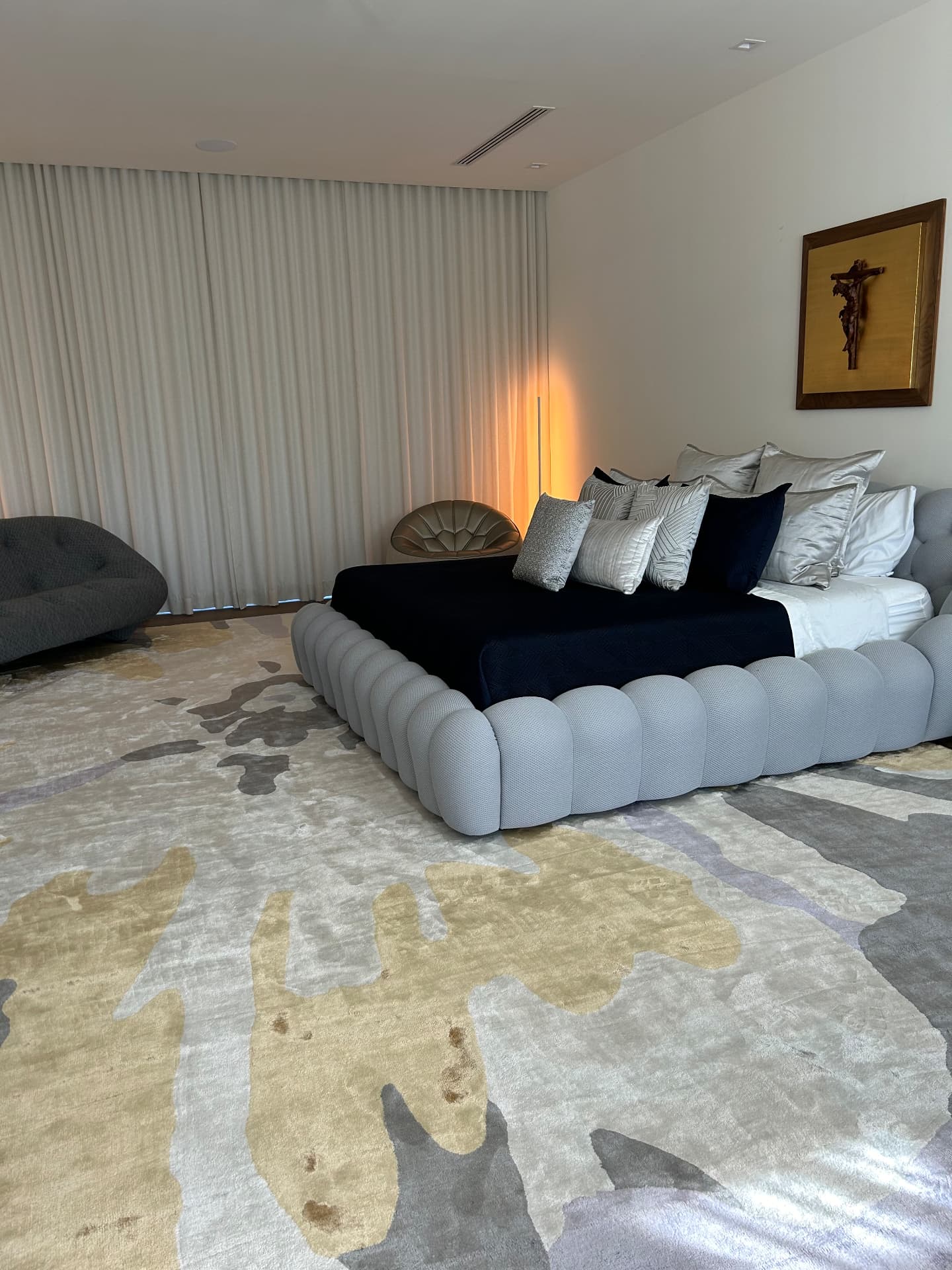 Pinecrest mansion primary bedroom with room-darkening drapery