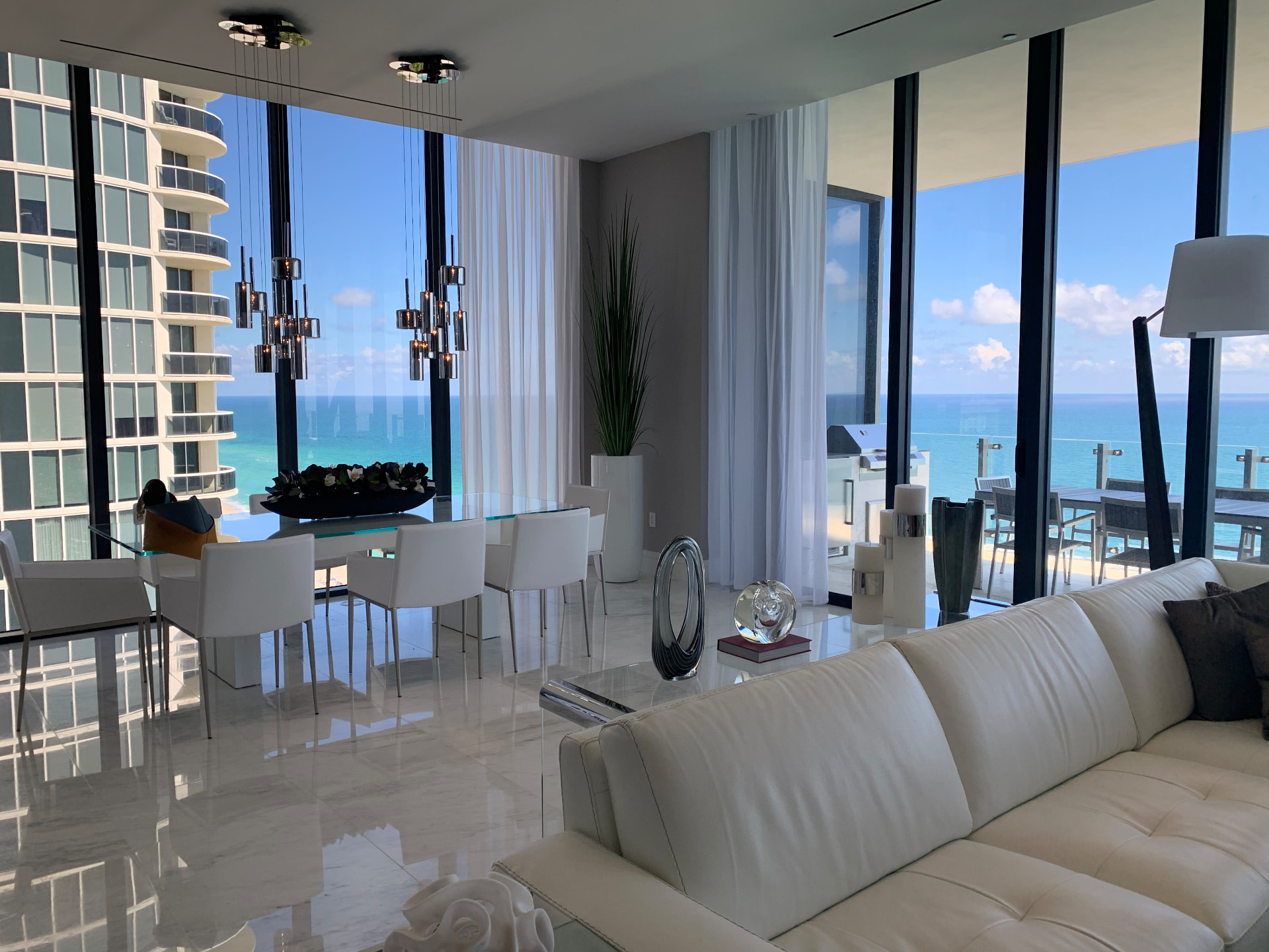 Aria Reserve dining room with sheer drapery and ocean view