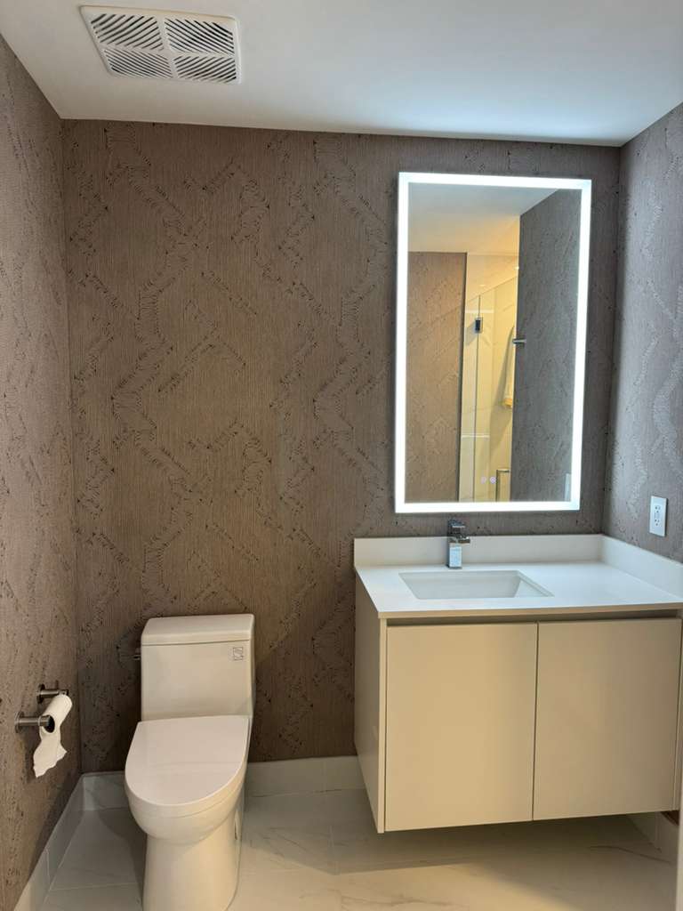 Aria Reserve secondary bathroom with tonal patterned wallcovering