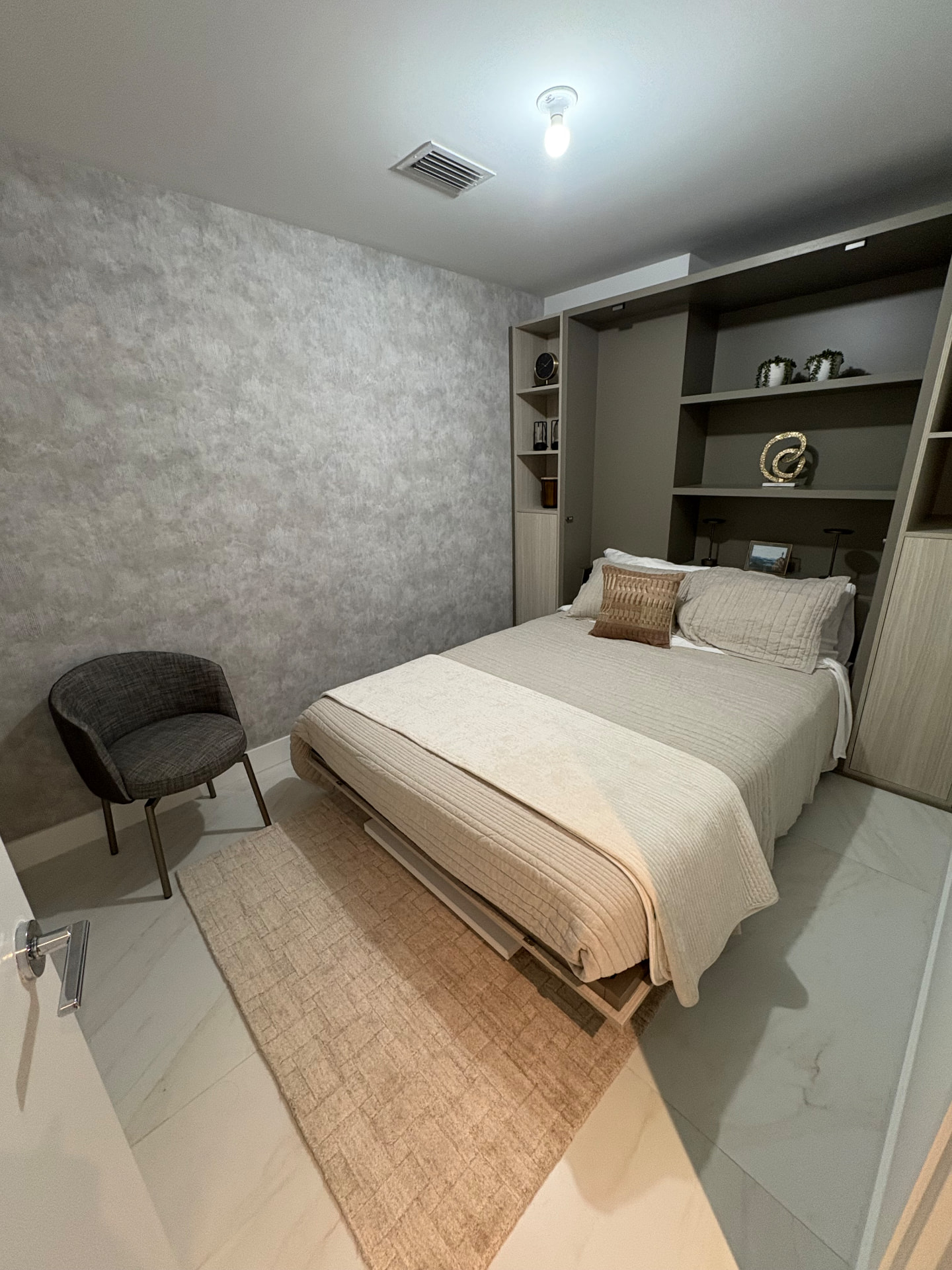 Aria Reserve guest room with Murphy bed wall unit and cloud-effect wallcovering
