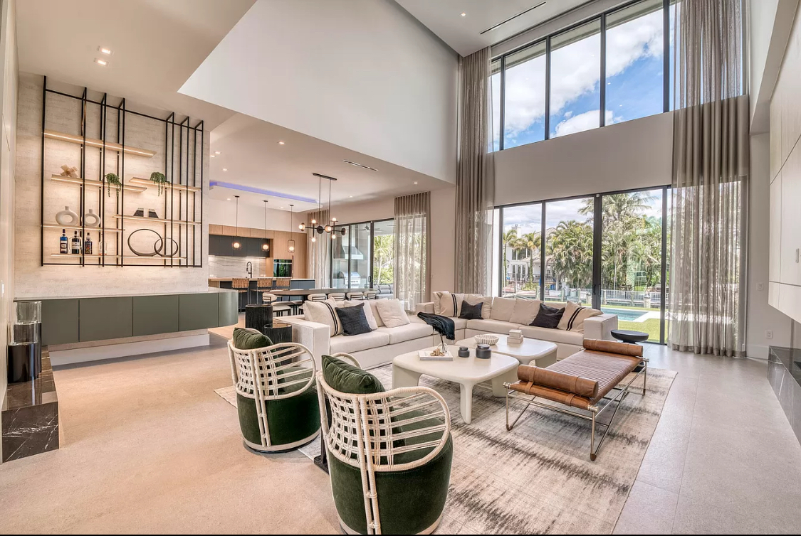 West Palm Beach estate double-height great room with full-height sheer drapery