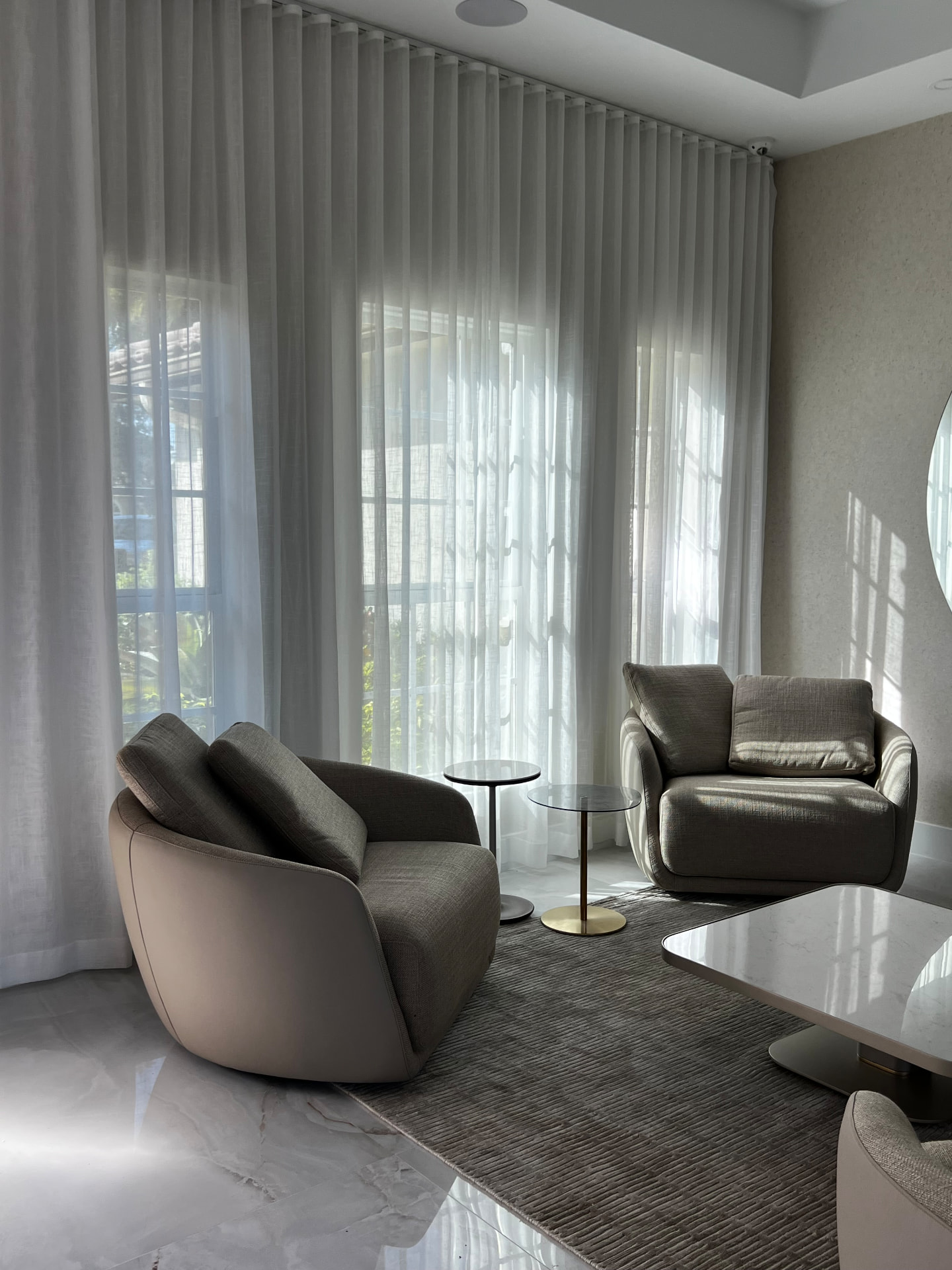Pembroke Pines sitting room with a corner run of sheer drapery