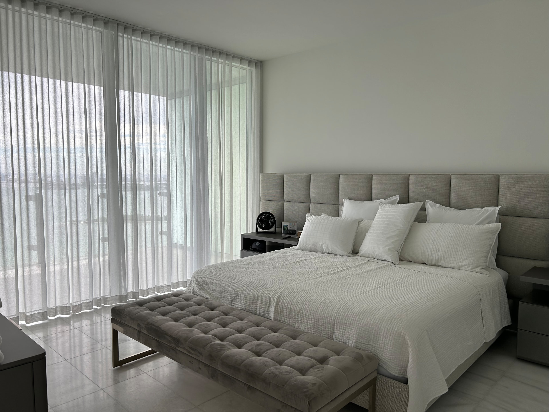 Missoni Baia primary bedroom with floor-to-ceiling sheer drapery
