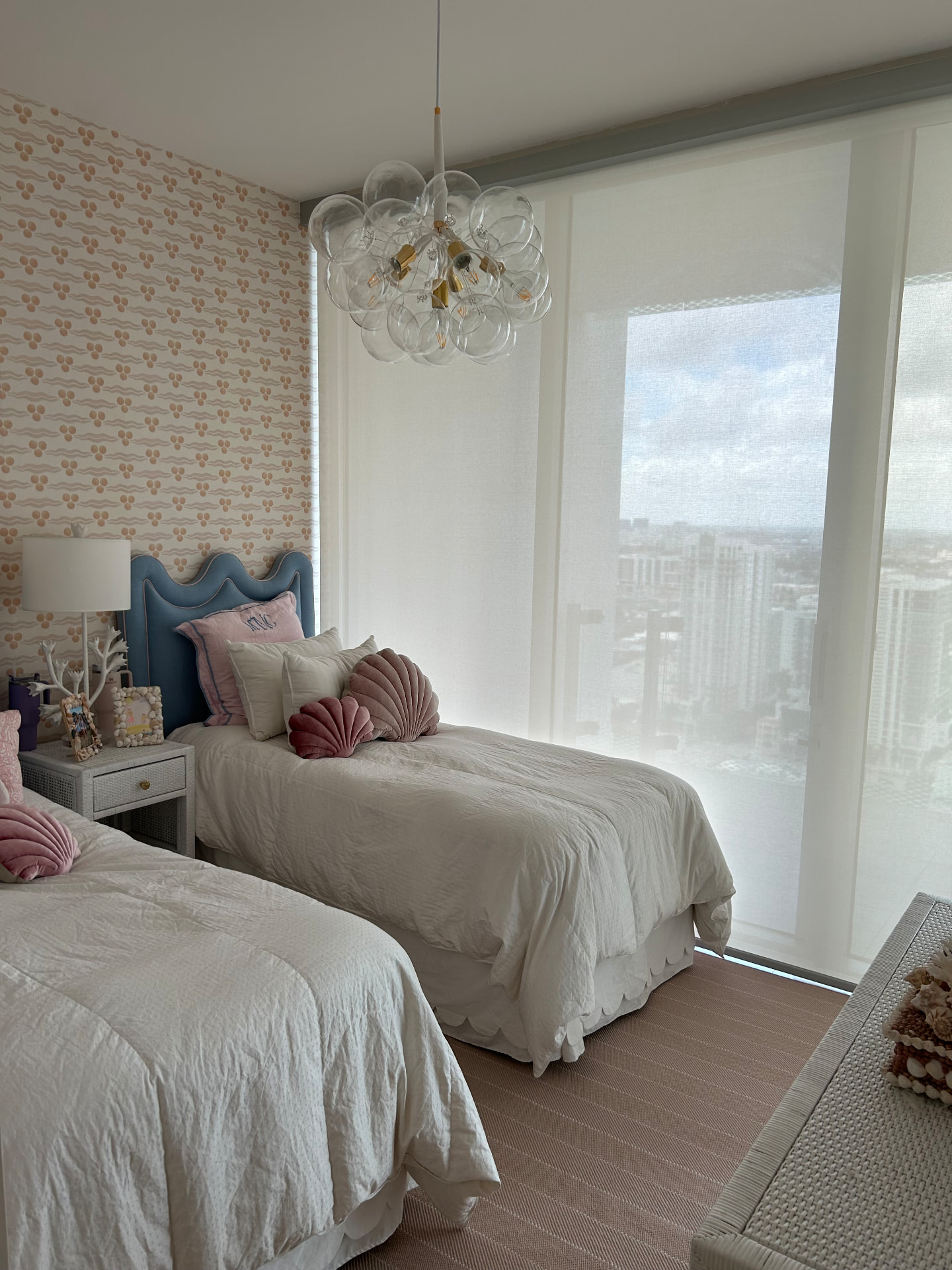 Missoni Baia children's bedroom with light-filtering shades and patterned wallpaper