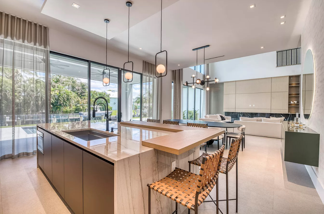West Palm Beach estate kitchen with sheer drapery by the pool doors
