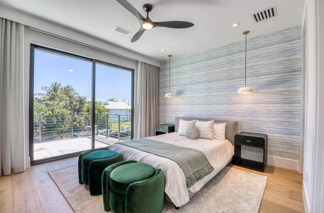 West Palm Beach estate bedroom with full-height drapery and textured wallcovering