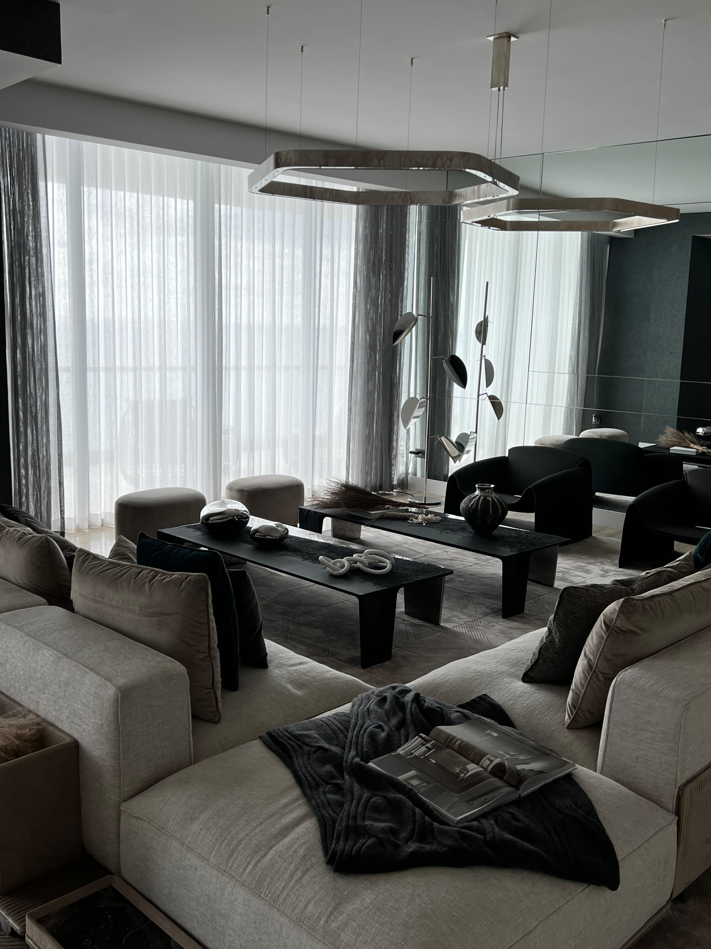 Turnberry living room with layered sheer and dim-out drapery