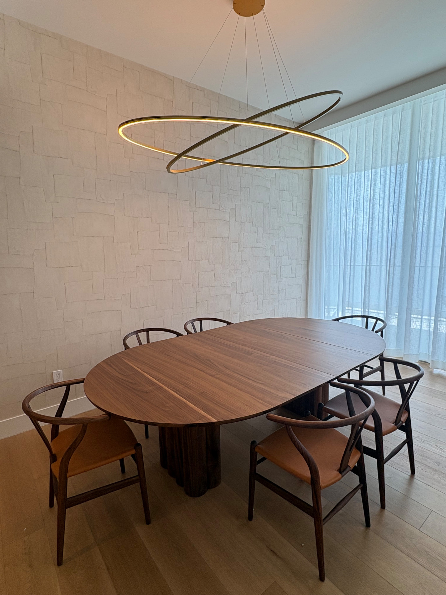 UNA Residences dining room with wallpaper and motorized sheer drapes