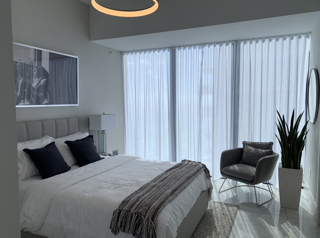 Missoni Baia bedroom with corner sheer drapery
